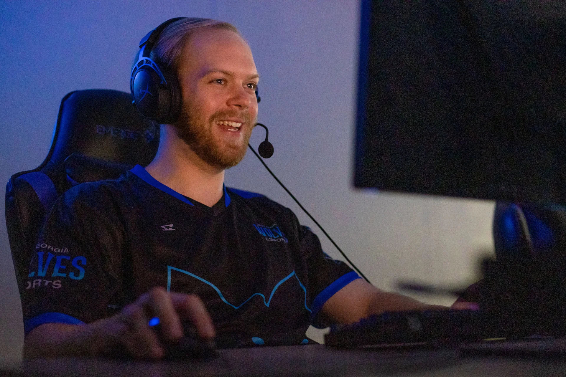 Student Smiling while playing esports