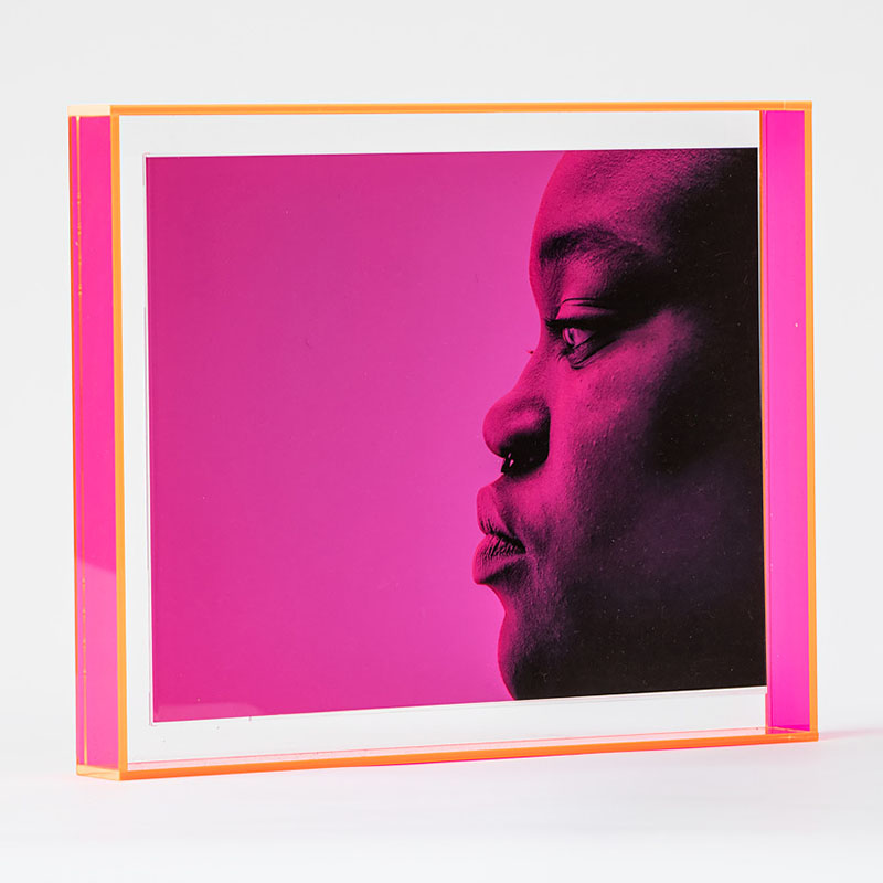 photo of profile portrait with pink background