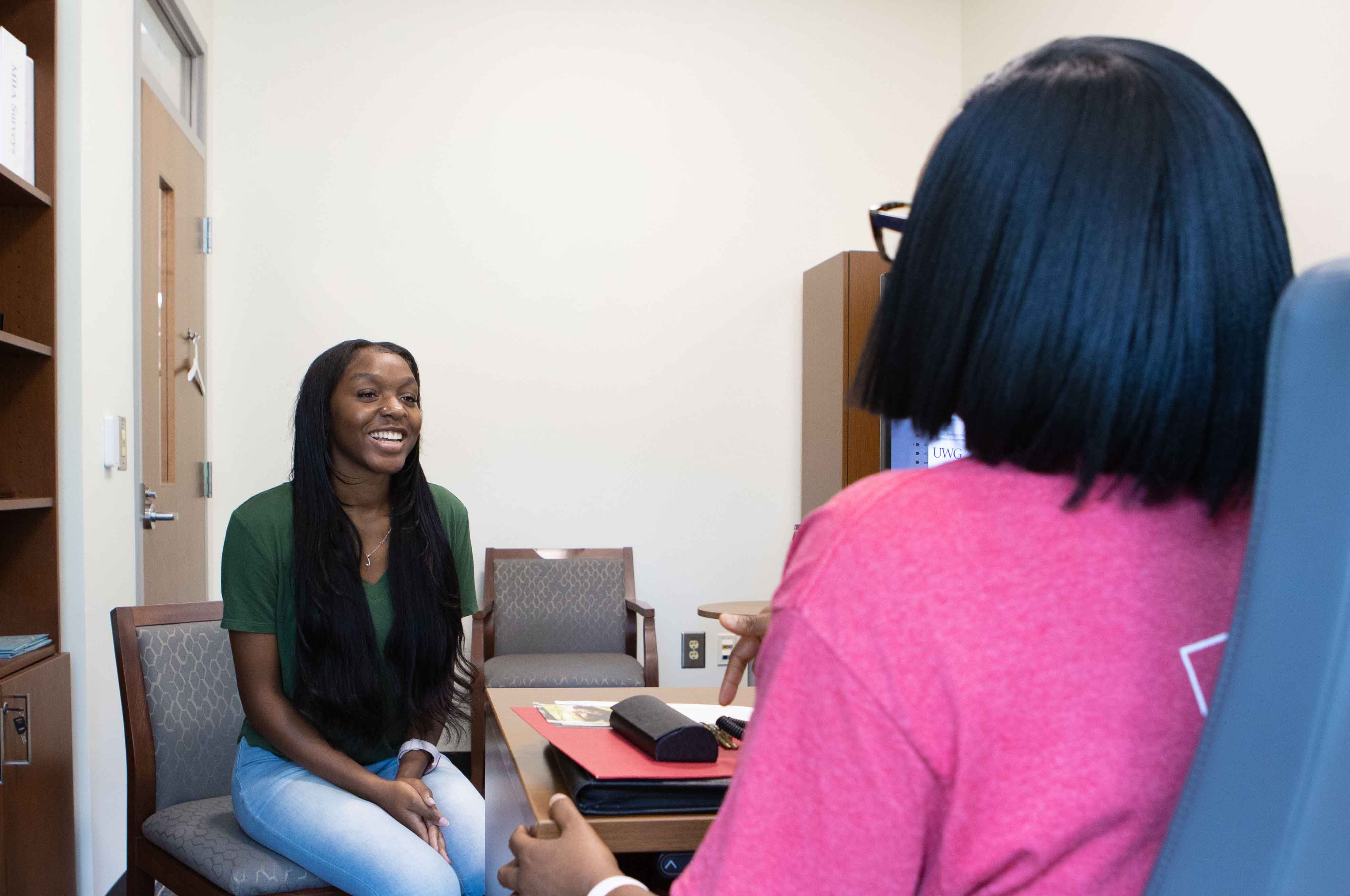 A student talking to an advisor