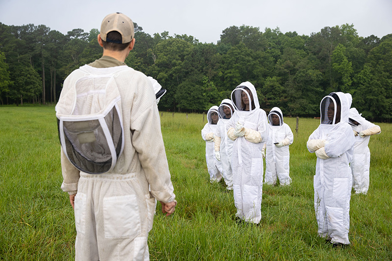 students suited up for beekeeping