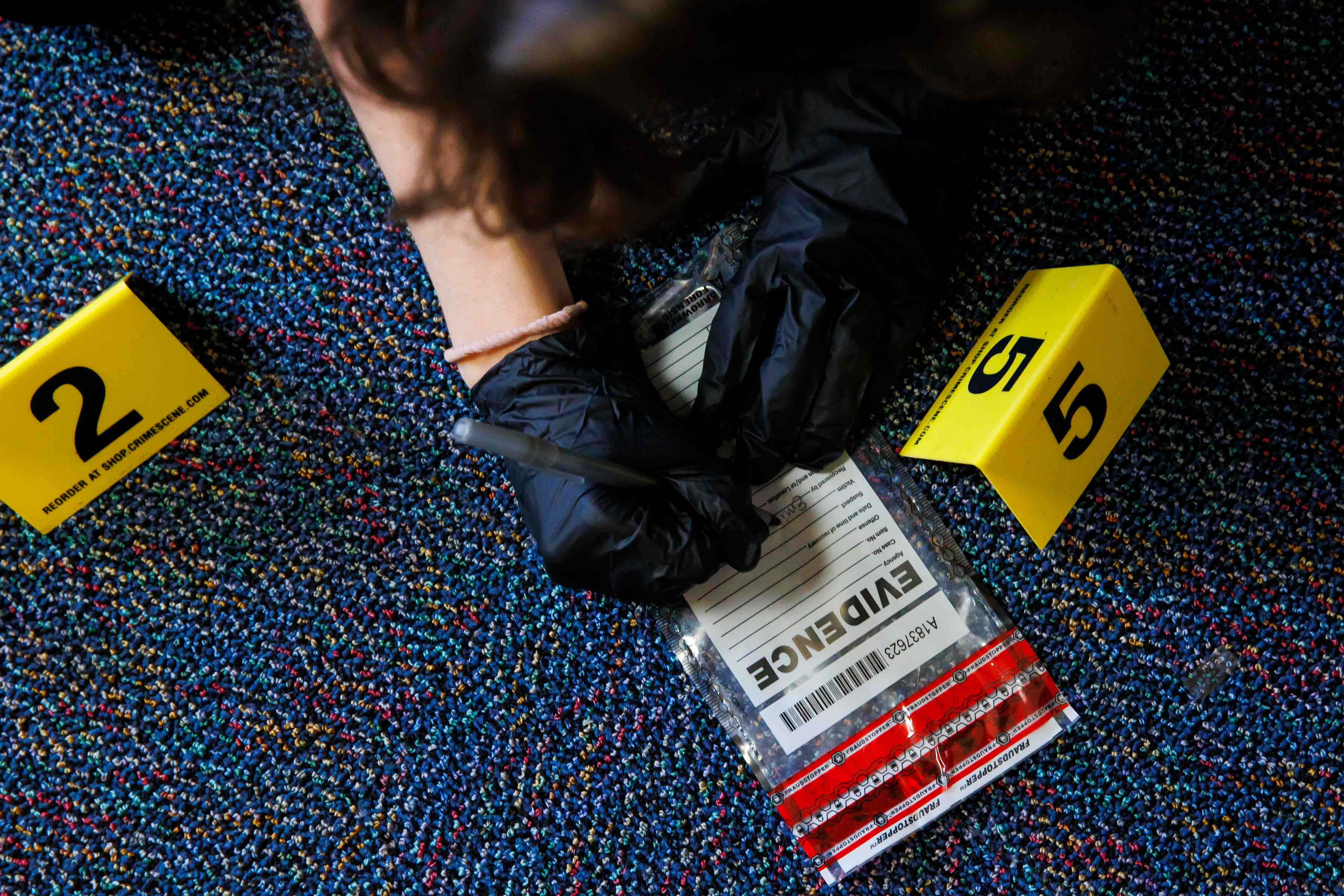 Criminology students process mock crime scenes in Strozier Hall