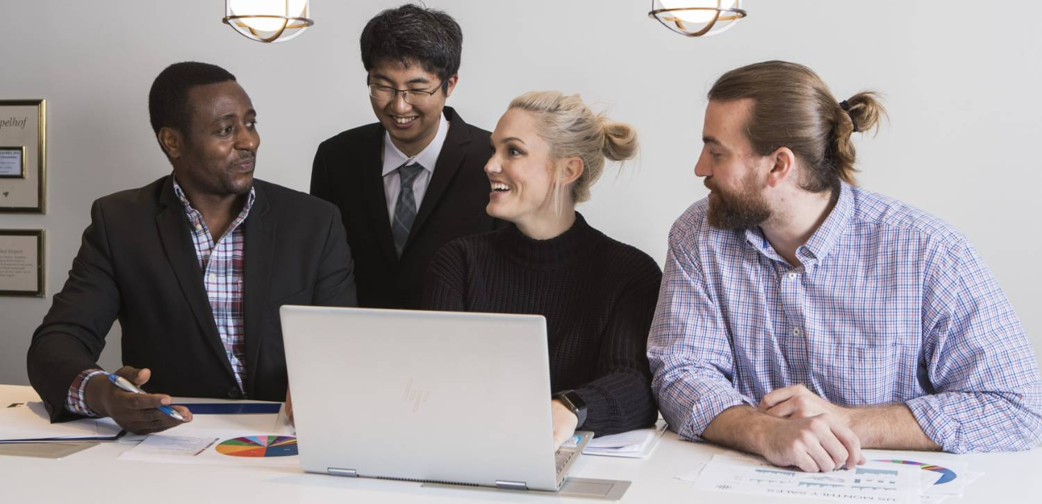 A group of people discussing files