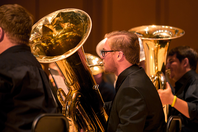 male playing tuba