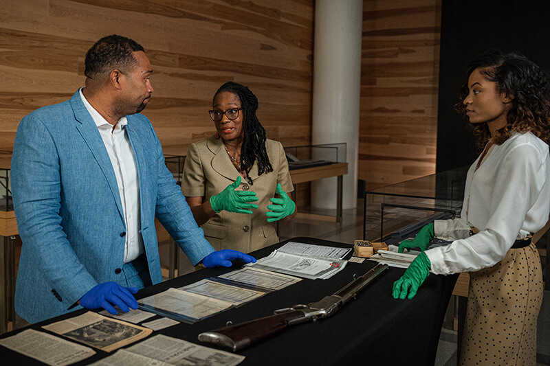 UWG alumna Autumn Smith (far right) on the set of “(Re)Defining History: Uncovering the 1906 Atlanta Race Massacre,” with Dr. Maurice J. Hobson (far left), historian and associate professor of Africana Studies at Georgia State University and Dr. Clarissa Myrick-Harris (middle), public historian and professor of Africana Studies at Morehouse College.