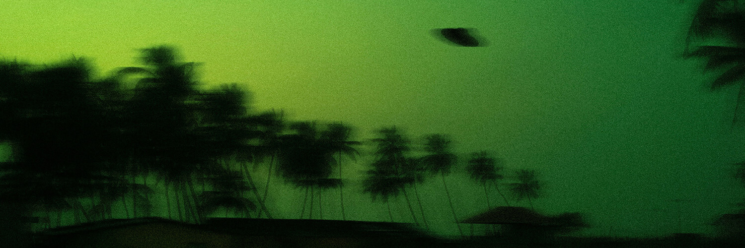 Possible UFO in a greenish sky