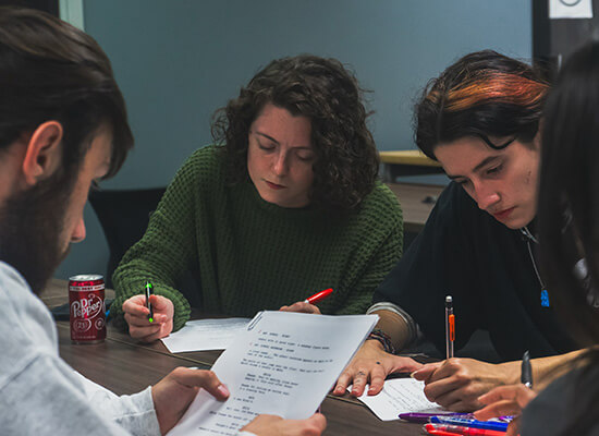 UWG film and production students working on a script