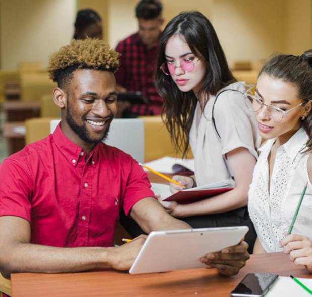 student at conference room table facing two professionals