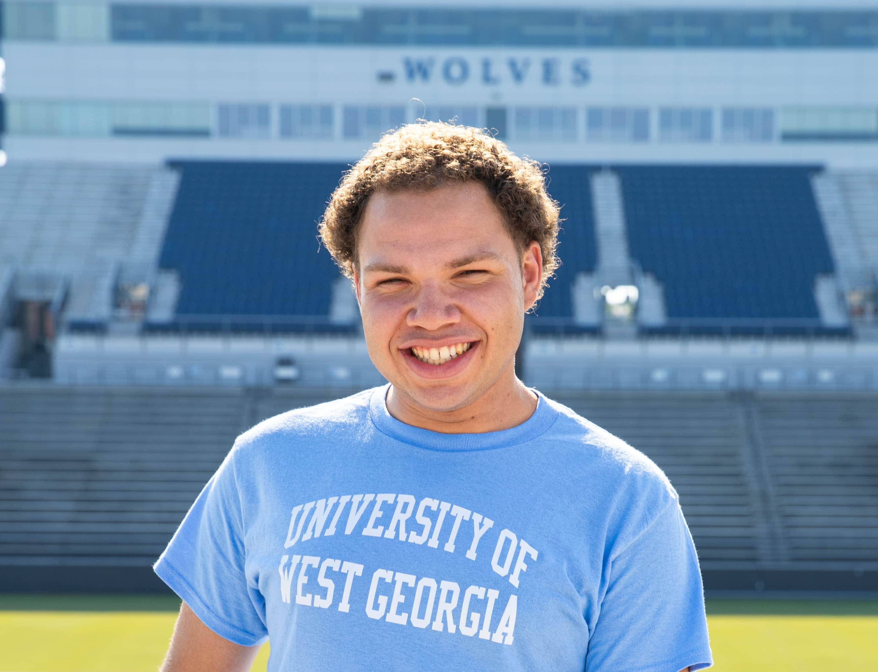 Marcus posing for an outside portait in the stadium.