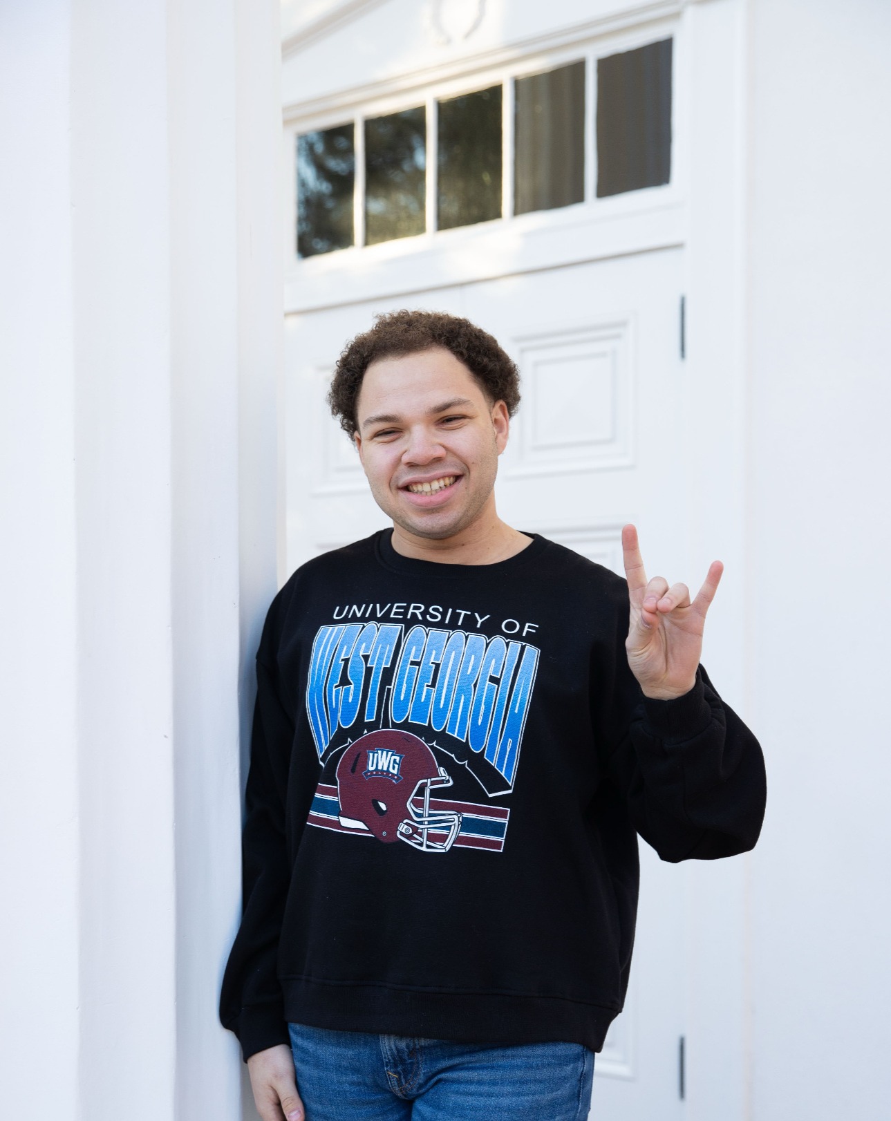 Marcus posing for an outside portait in his UWG gear.