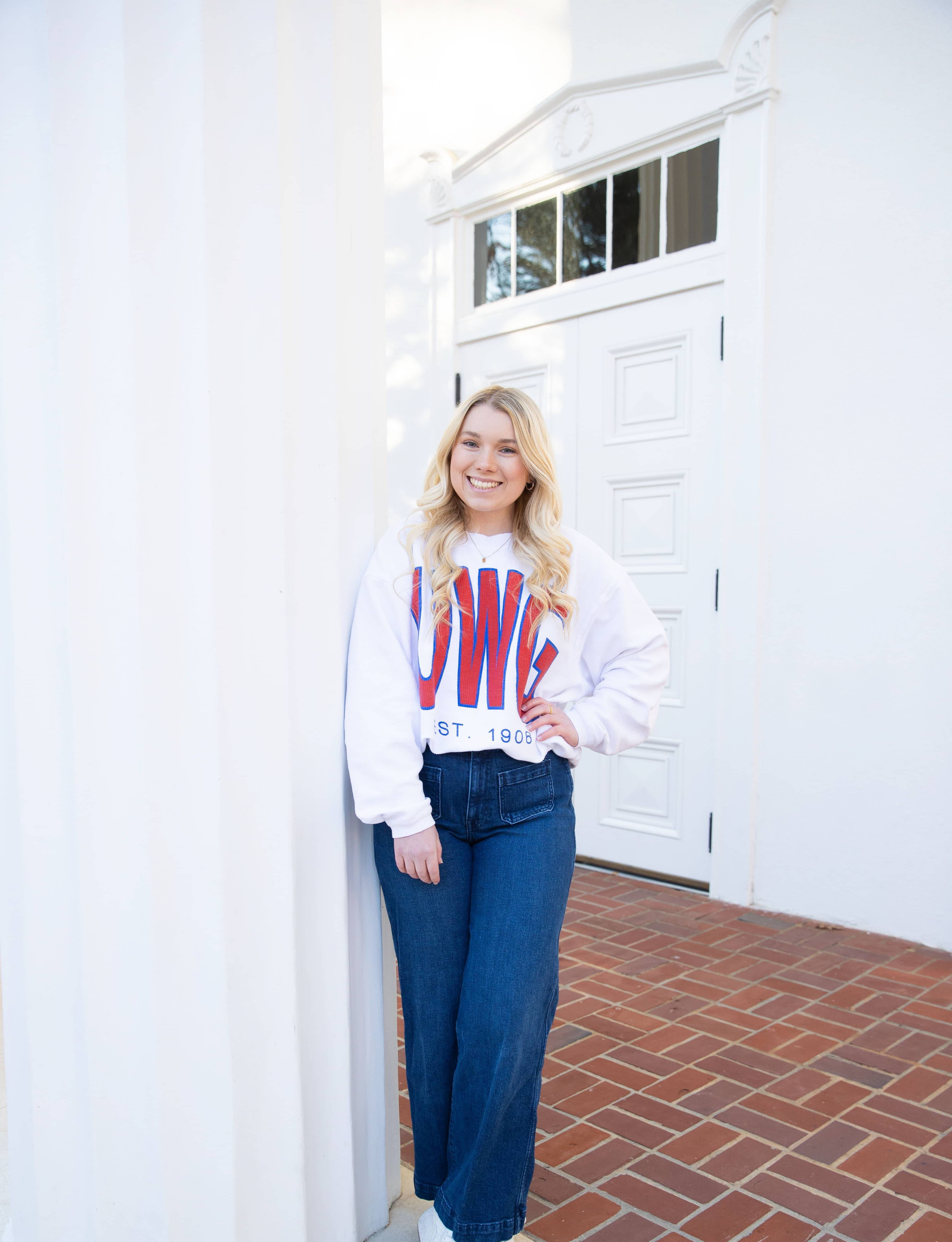 Carlie Pair posing for an outside portait in her favorite UWG sweater!