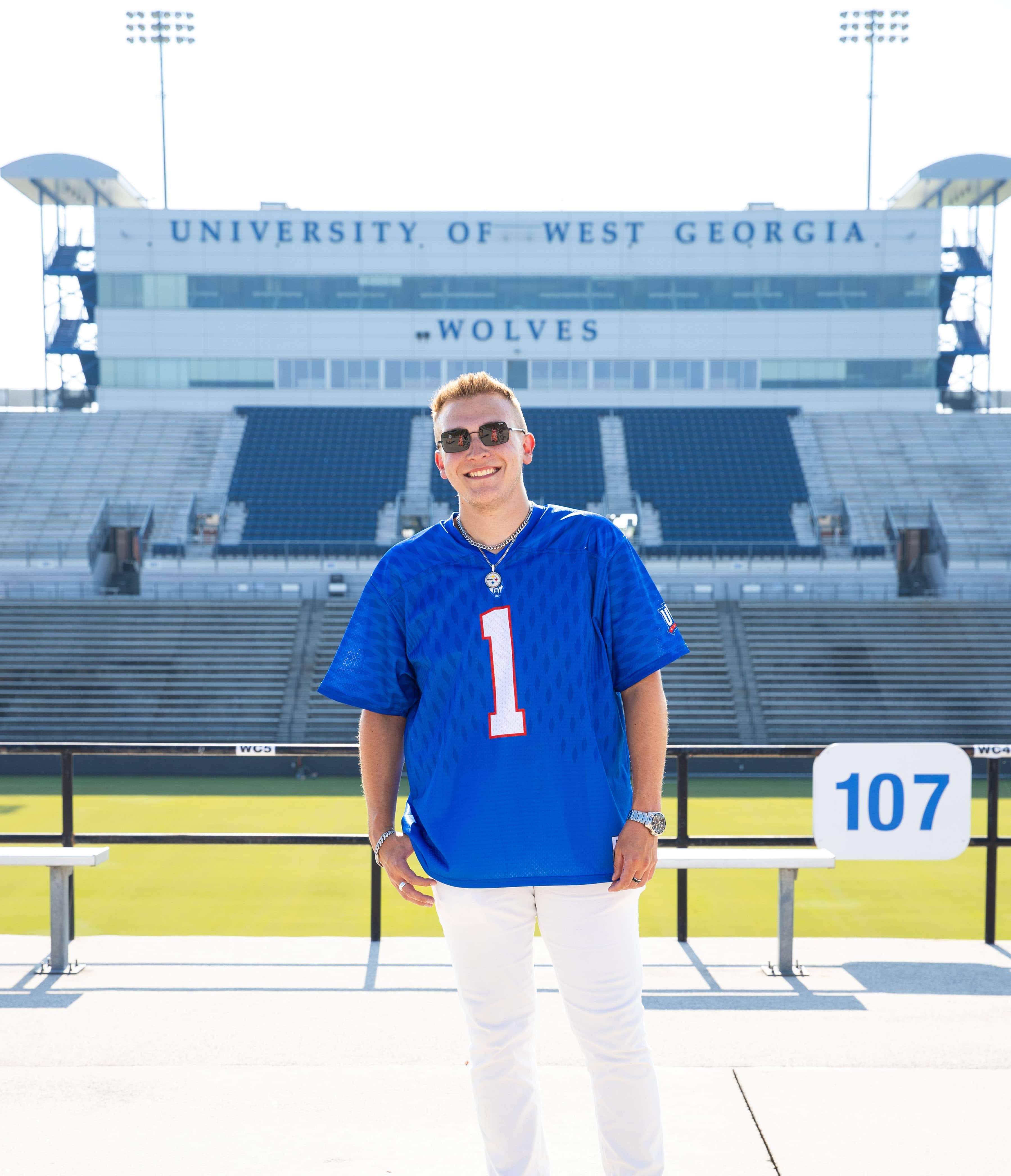 Brendan Willoughby-Ray posing for an outside portait in the stadium.