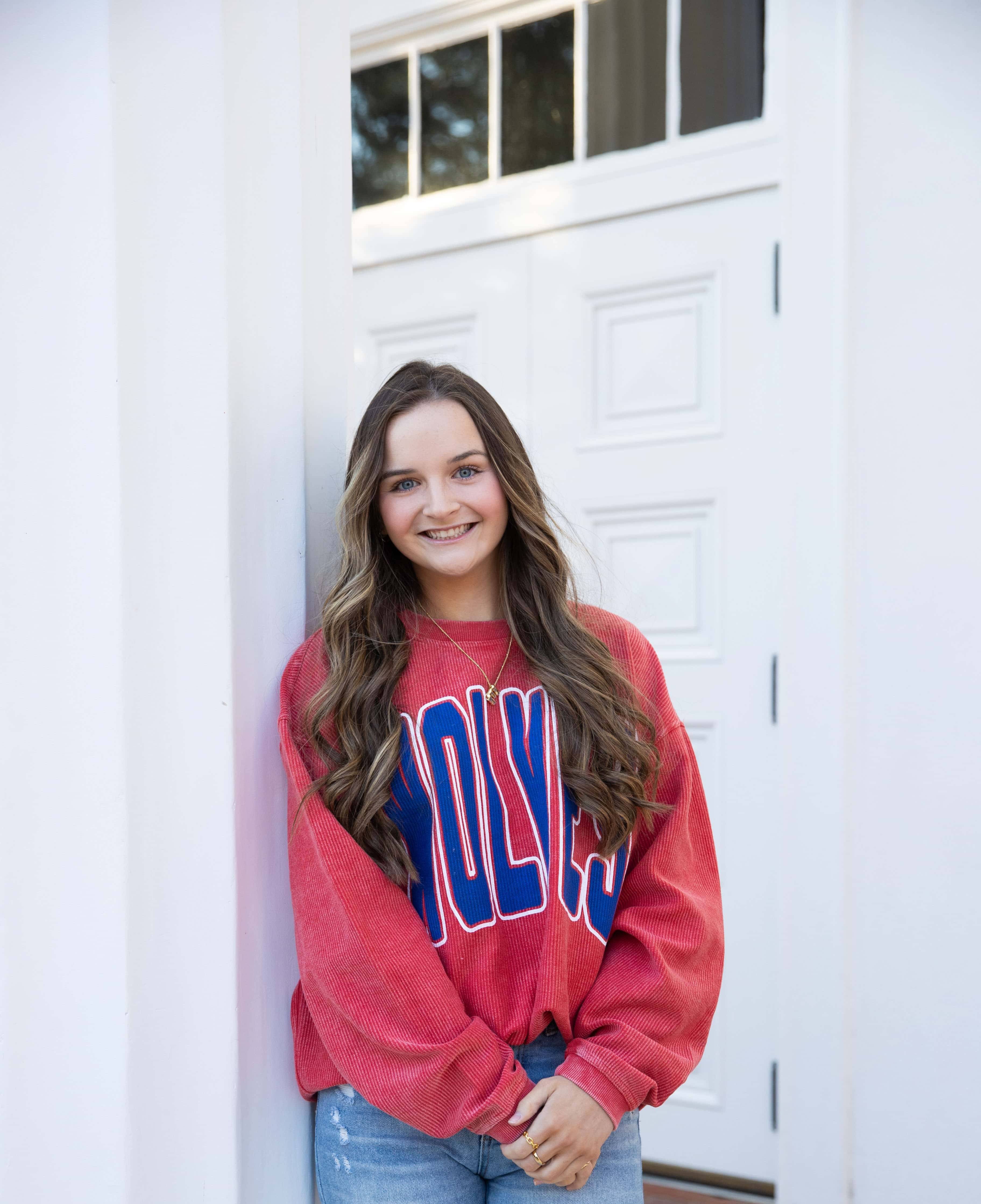 Ella Tankersly posing for portaits wearing her UWG attire.