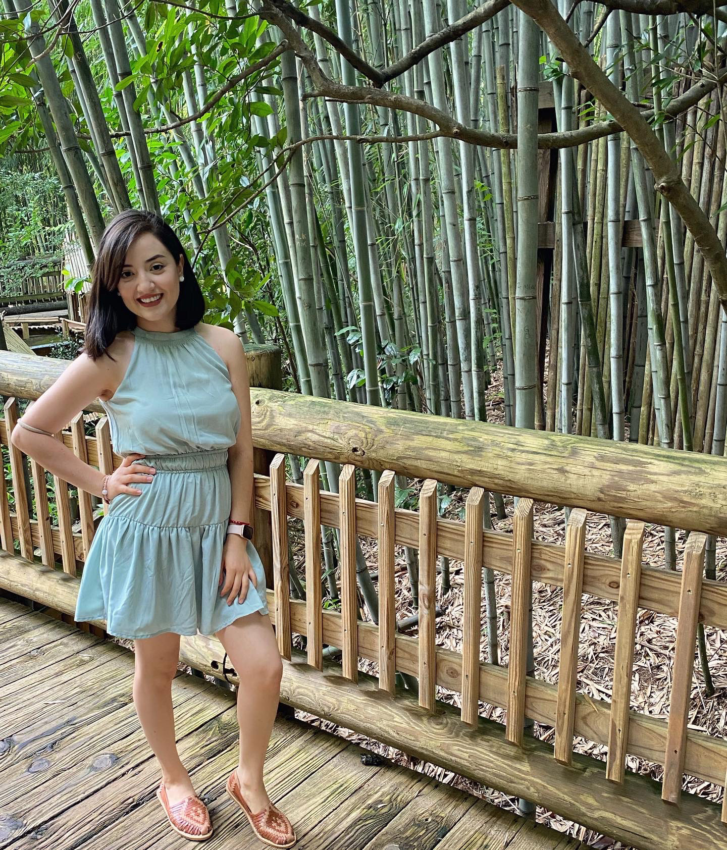 Photo of Alondra posing on a bridge